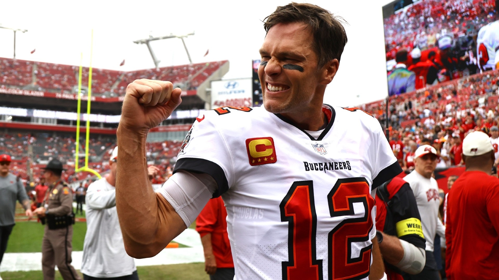 Tom Brady asks for some space as he leads Bucs in the huddle