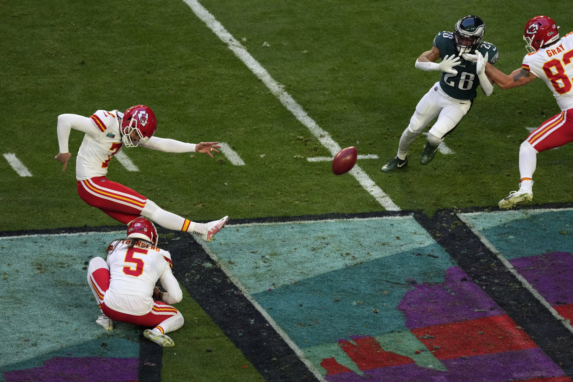 Kansas City Chiefs place kicker Harrison Butker (7) kicks the point after as punter Tommy Townsend (5) holds during the first half of the NFL Super Bowl 57 football game against the Philadelphia Eagles, Sunday, Feb. 12, 2023, in Glendale, Ariz. (AP Photo/Charlie Riedel)