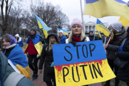 Demonstrators march outside of the White House in support of Ukraine during a rally in Washington, Saturday, Feb. 25, 2023. (AP Photo/Jose Luis Magana)