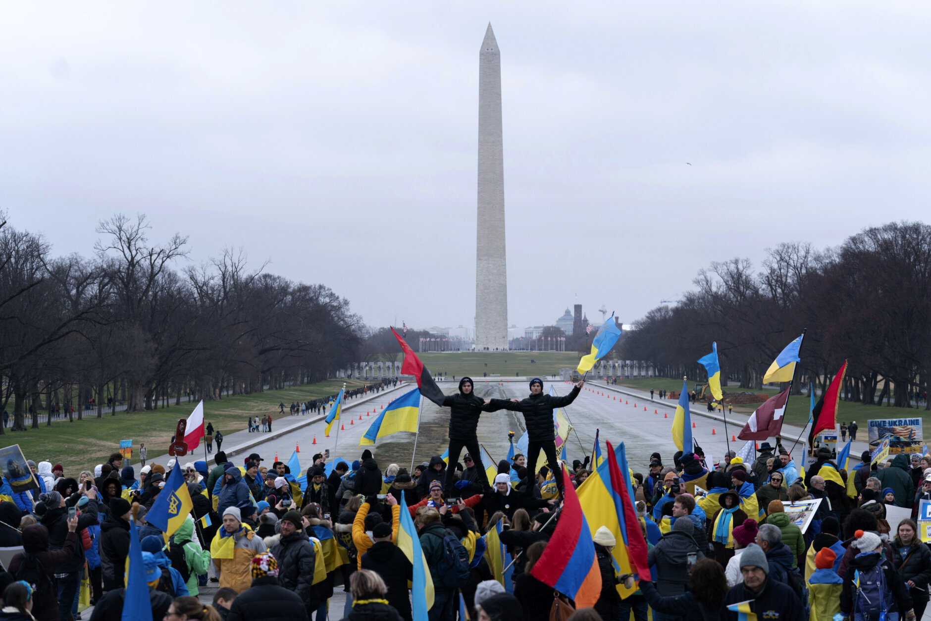 Demonstrators holding Ukrainian flags rally in support of Ukraine at the Lincoln Memorial in Washington, Saturday, Feb. 25, 2023. (AP Photo/Jose Luis Magana)