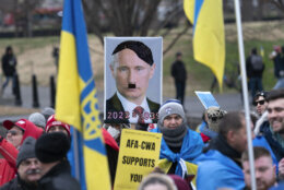 Demonstrators rally in support of Ukraine at the Lincoln Memorial in Washington, Saturday, Feb. 25, 2023. (AP Photo/Jose Luis Magana)