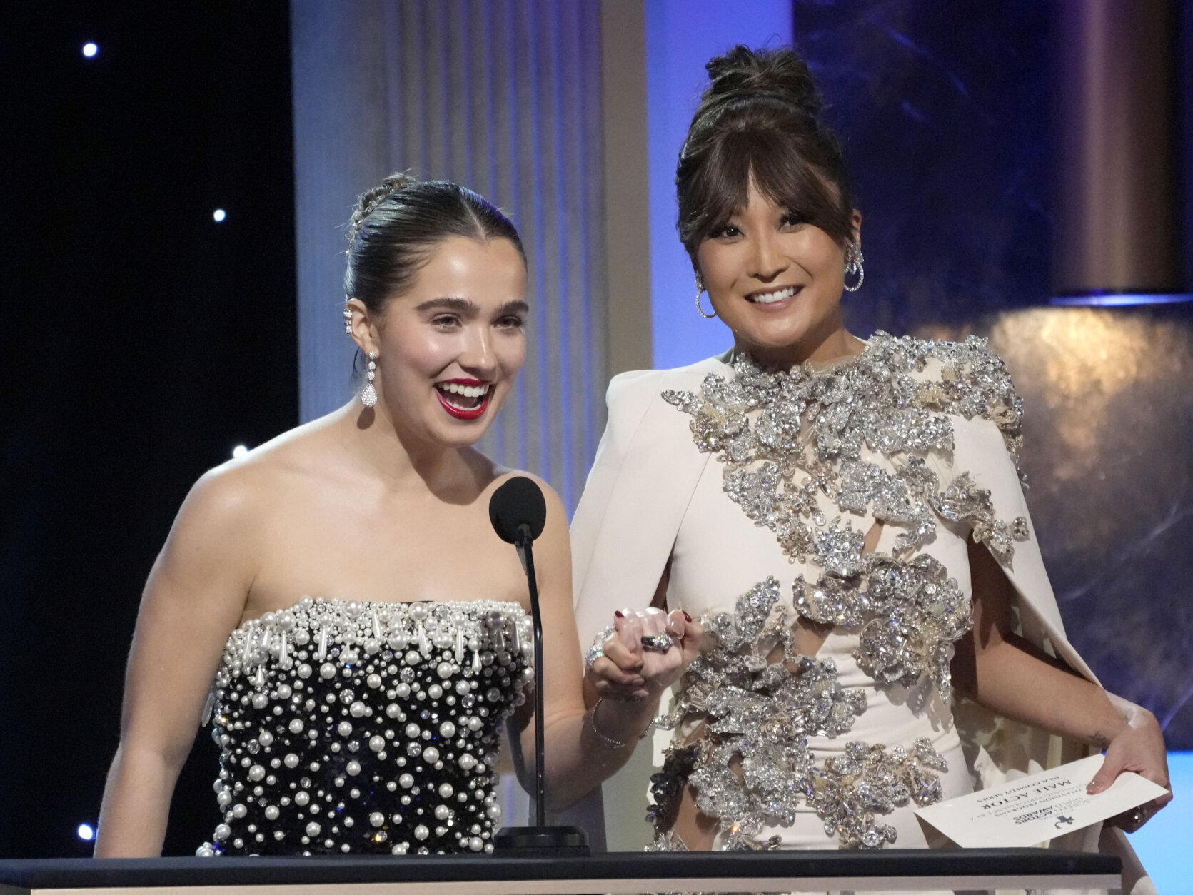 Haley Lu Richardson, left, and Ashley Park present the award for outstanding performance by a male actor in a comedy series at the 29th annual Screen Actors Guild Awards on Sunday, Feb. 26, 2023, at the Fairmont Century Plaza in Los Angeles. (AP Photo/Chris Pizzello)