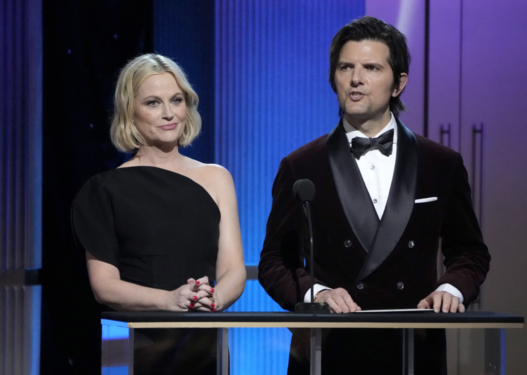 Amy Poehler, left, and Adam Scott present the award for outstanding performance by a female actor in a comedy series at the 29th annual Screen Actors Guild Awards on Sunday, Feb. 26, 2023, at the Fairmont Century Plaza in Los Angeles. (AP Photo/Chris Pizzello)