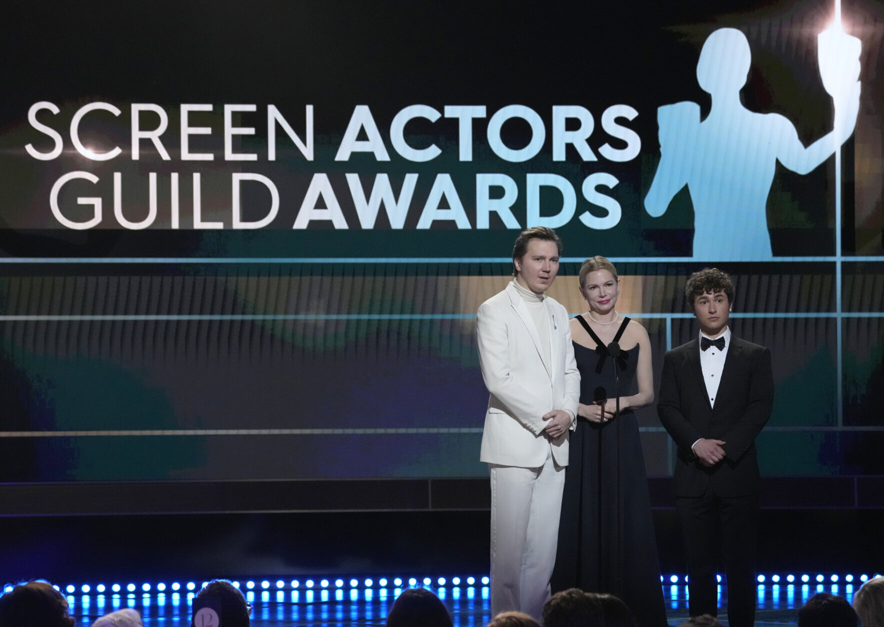 Paul Dano, from left, Michelle Williams and Gabriel LaBelle, members of the cast of "The Fablemans," introduce a clip from their film at the 29th annual Screen Actors Guild Awards on Sunday, Feb. 26, 2023, at the Fairmont Century Plaza in Los Angeles. (AP Photo/Chris Pizzello)