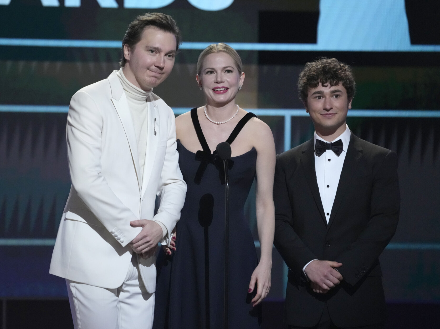 Paul Dano, from left, Michelle Williams and Gabriel LaBelle, members of the cast of "The Fablemans," introduce a clip from their film at the 29th annual Screen Actors Guild Awards on Sunday, Feb. 26, 2023, at the Fairmont Century Plaza in Los Angeles. (AP Photo/Chris Pizzello)