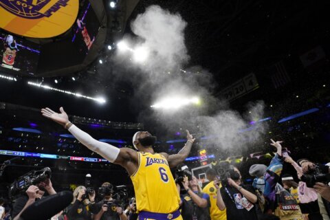 LeBron James makes NBA history on a star-filled night in LA