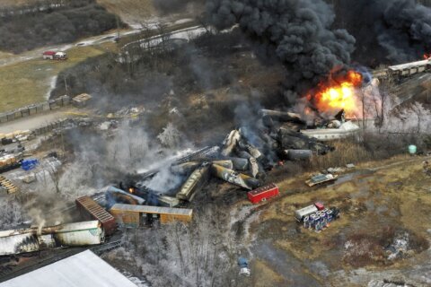 National Guard activated to help town as derailment smolders