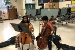 The benefits flow both ways. The young students learn and thrive under the tutelage of bigger kids, and the bigger kids find joy working with the youngsters and helping them explore music and art.