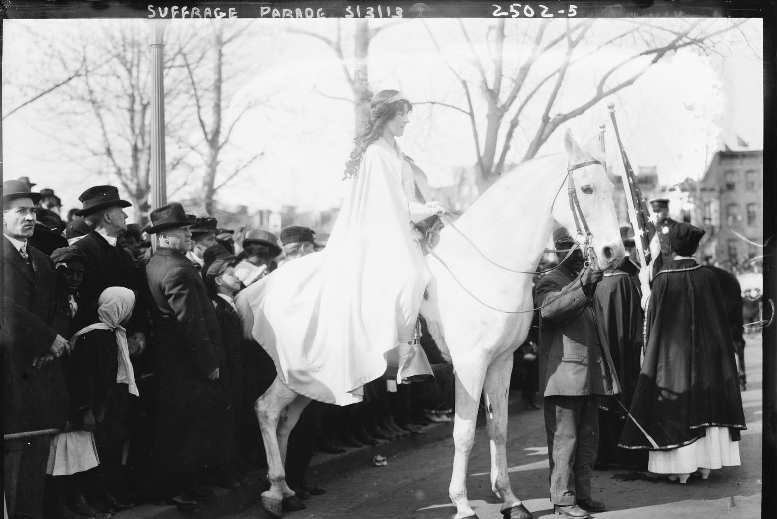 In this photo provided by the Library of Congress, taken in 1913, attorney Inez Milholland Boissevain rides astride suffrage parade in Washington as the first of four mounted heralds. (Library of Congress via AP)