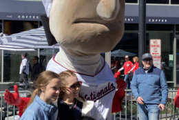 Fans pose with George Washington, one of the National's famous "Racing Presidents." (WTOP/Scott Gelman)