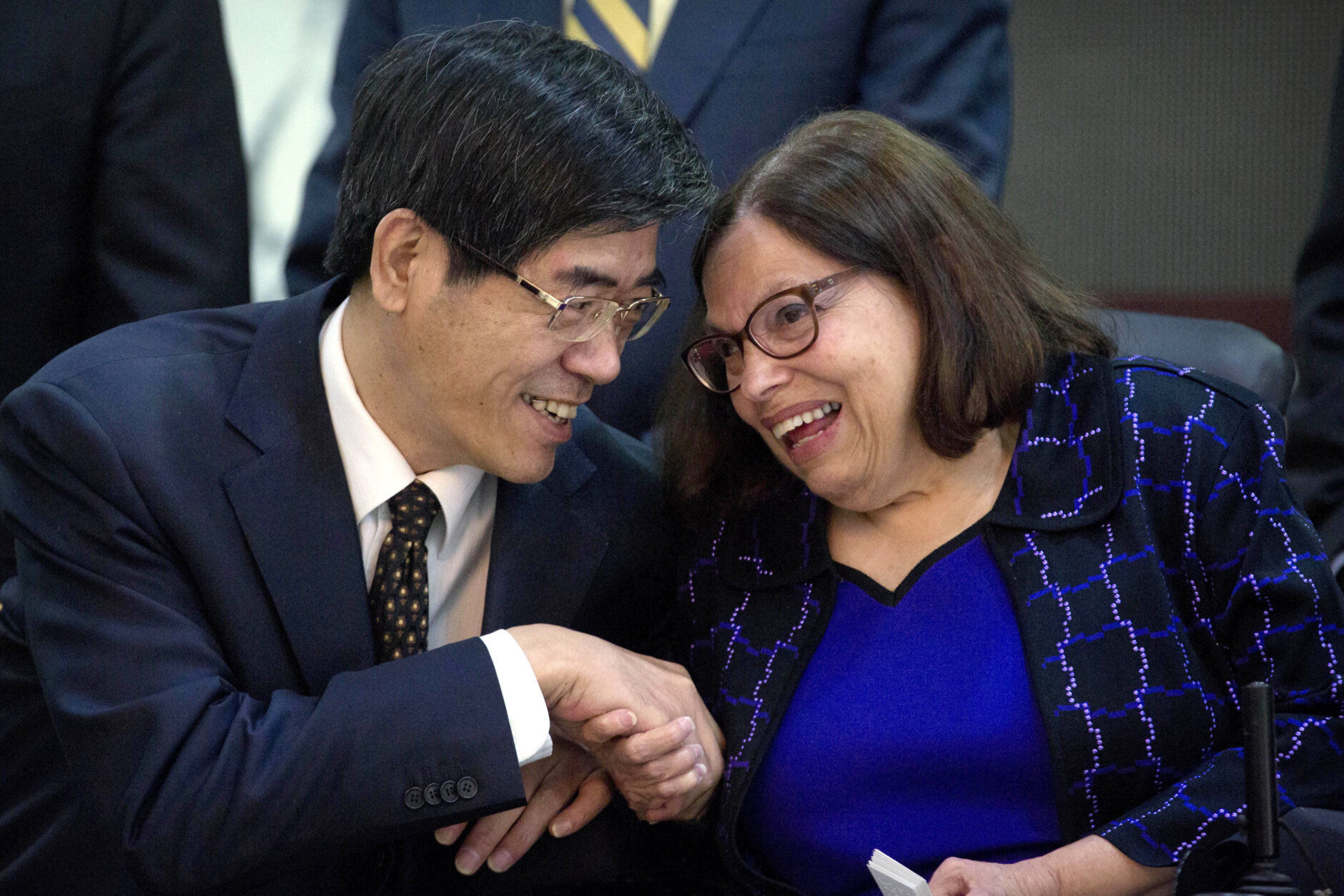 Lu Yong, left, president of the China Disabled Persons' Federation, talks with Judith Heumann, right, Special Advisor for International Disability Rights at the U.S. Department of State, after the opening session of the China-U.S. Coordination Meeting on Disability in Beijing, Tuesday, April 12, 2016. (AP Photo/Mark Schiefelbein, Pool)