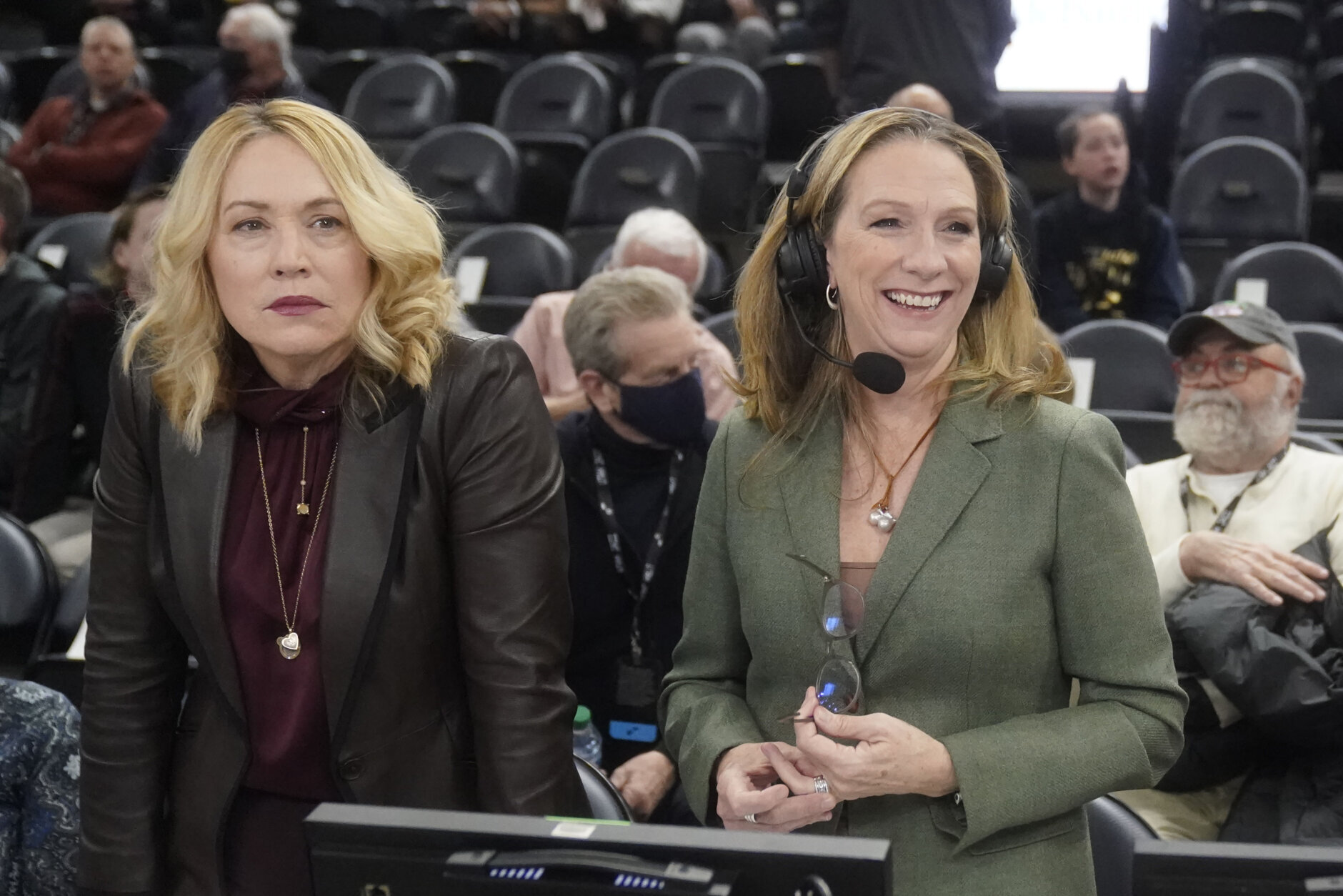 FILE - ESPN's Doris Burke and Beth Mowins look on before the start of NBA basketball game between the Utah Jazz and Golden State Warriors Wednesday, Feb. 9, 2022, in Salt Lake City. An all-female ensemble will produce  Wednesday's March 8, 2023, game between the Dallas Mavericks and New Orleans Pelicans in New Orleans. It's a way to celebrate International Women’s Day. (AP Photo/Rick Bowmer, File)
