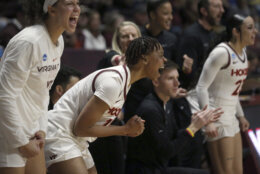CORRECTS TO SECOND-ROUND NOT FIRST-ROUND -Virginia Tech's D'asia Gregg (11) center, celebrates after an offensive score in the second quarter of a second-round college basketball game against South Dakota State in the women's NCAA Tournament, Sunday, March 19, 2023, in Blacksburg, Va. (AP Photo/Matt Gentry)