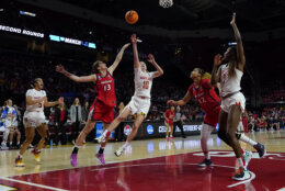 Maryland guard Abby Meyers (10) throws up a shot against Arizona guard Helena Pueyo (13) during the second half of a second-round college basketball game in the NCAA Tournament, Sunday, March 19, 2023, in College Park, Md. Maryland won 77-64. (AP Photo/Julio Cortez)