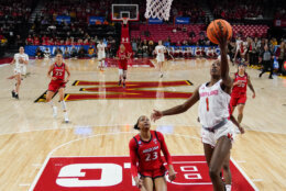 Maryland guard Diamond Miller (1) goes up for a shot in front of Arizona guard Lauren Fields (23) during the first half of a second-round college basketball game in the NCAA Tournament, Sunday, March 19, 2023, in College Park, Md. Maryland won 77-64. (AP Photo/Julio Cortez)