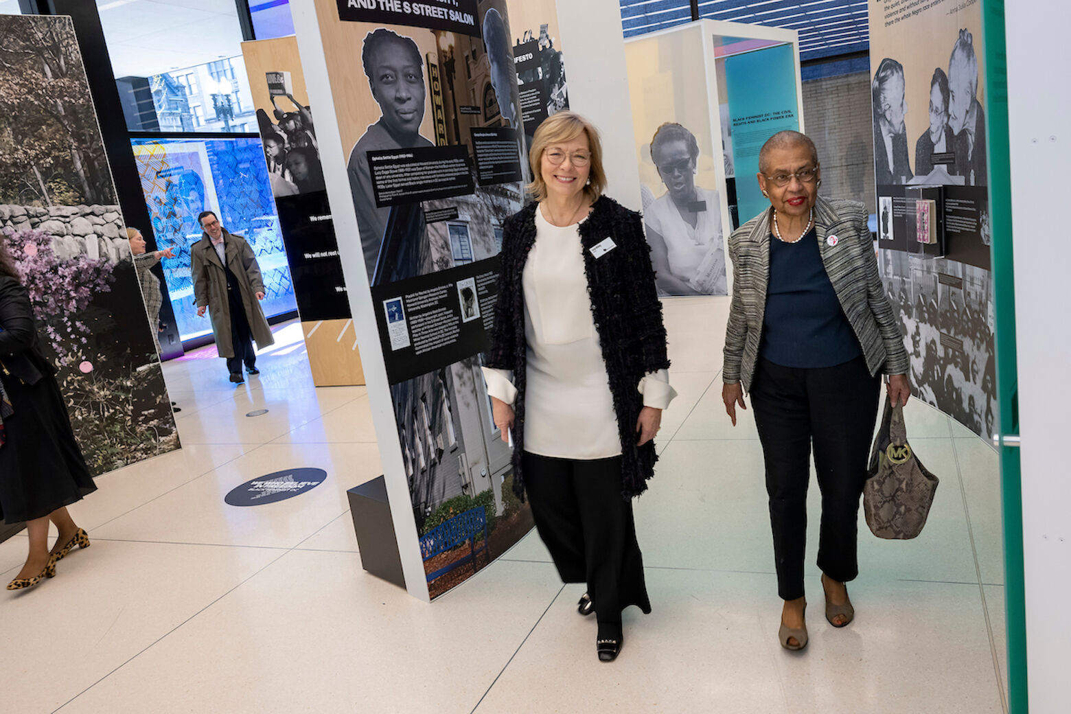 Susan Whiting, National Women’s History Museum Board Chair, and Rep. Eleanor Holmes Norton explore the exhibit. (Lisa Helfert/National Women's History Museum)