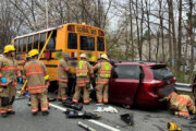 1 adult critically injured after minivan crashes into school bus in Montgomery Co.