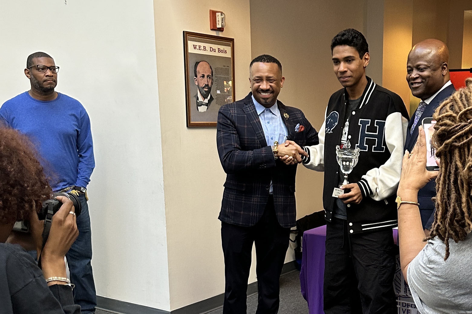 Malik Castro-DeVarona received first-place award from Dr. Kevin James, President of Morris Brown College (WTOP/Melissa Howell)