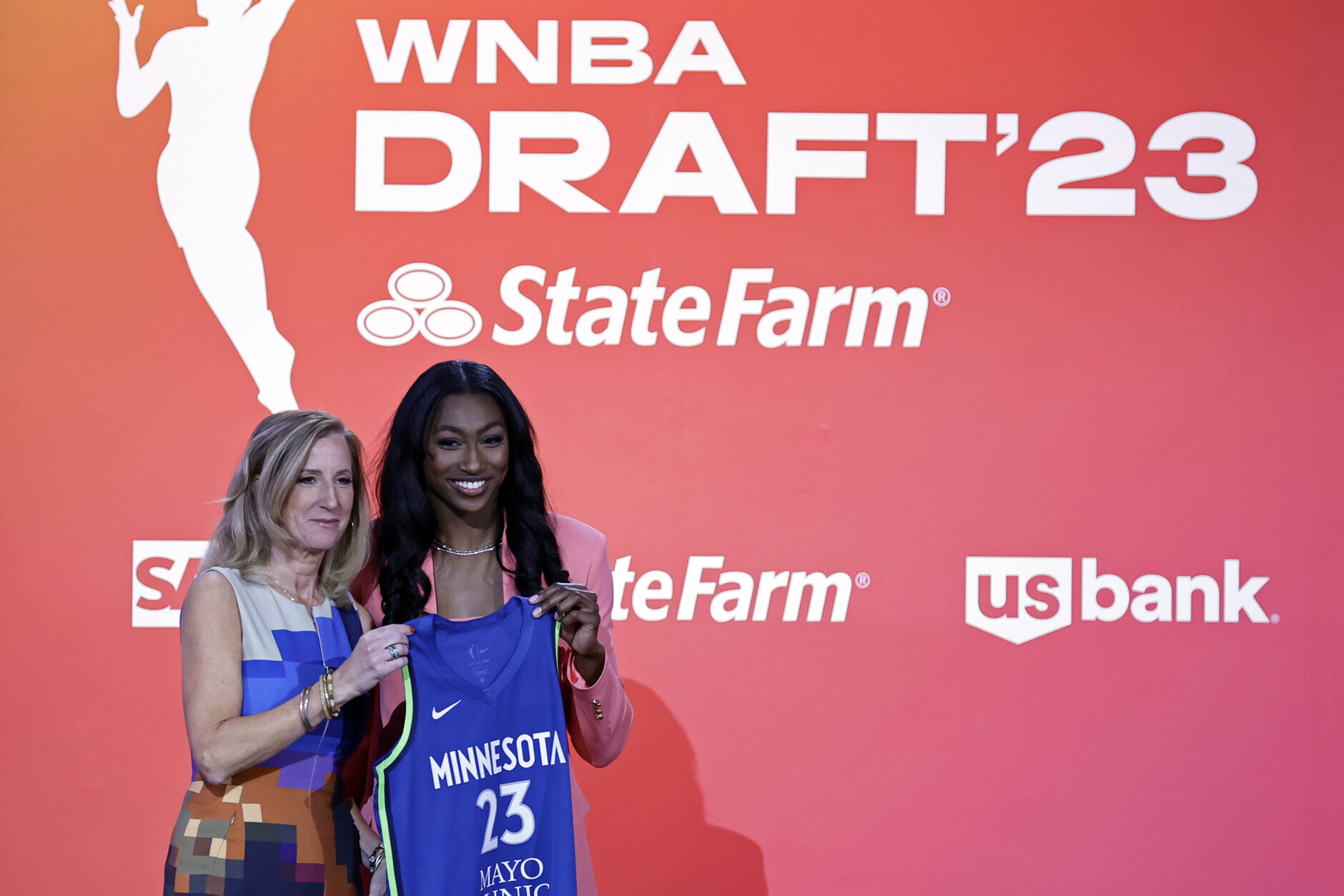 Maryland's Diamond Miller, right, poses for a photo with commissioner Cathy Engelbert after being selected by the Minnesota Lynx at the WNBA basketball draft Monday, April 10, 2023, in New York. (AP Photo/Adam Hunger)