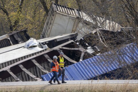 Containers secured to shore after Wisconsin train derailment