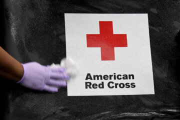 LAS VEGAS, NEVADA - MARCH 27:  American Red Cross employee Darryl Thompson Jr. sanitizes a blood bed during an American Red Cross blood drive to help alleviate a blood supply shortage as a result of the coronavirus pandemic at Las Vegas Motor Speedway on March 27, 2020 in Las Vegas, Nevada. (Photo by Ethan Miller/Getty Images)