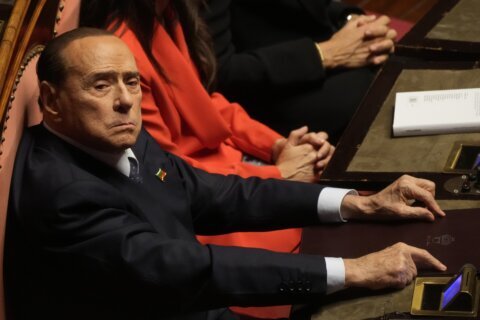 Berlusconi's treatment for infection continues in hospital