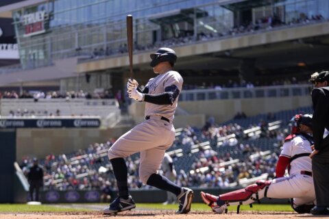 Judge drives in 3, helps Yanks top Twins 12-6 to avoid sweep