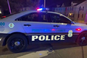 a police cruiser seen from side at night