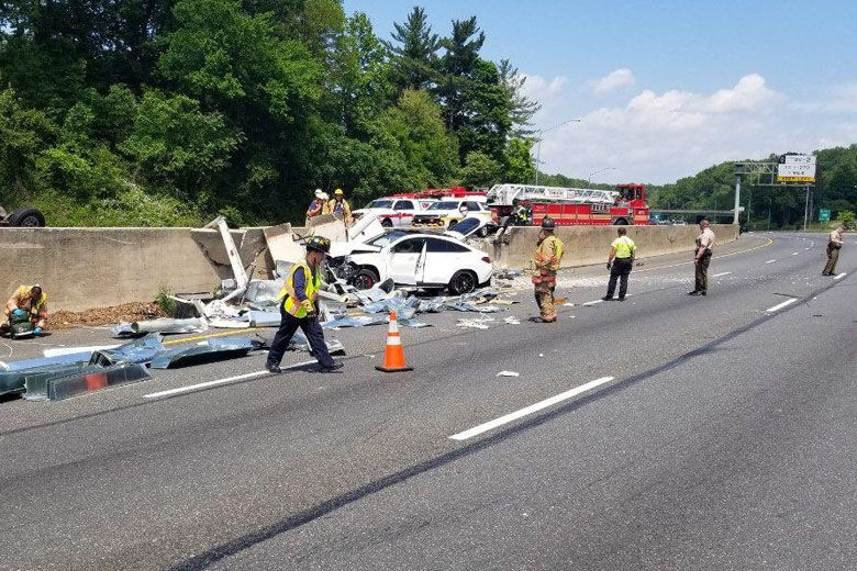 Three people were hurt after a box truck carrying ceiling tiles crashed on the Capital Beltway Wednesday afternoon, prompting lengthy delays for drivers. (Courtesy Montgomery County Fire and Rescue Service)