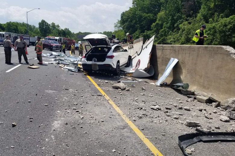 Three people were hurt after a box truck carrying ceiling tiles crashed on the Capital Beltway Wednesday afternoon, prompting lengthy delays for drivers. (Courtesy Montgomery County Fire and Rescue Service)