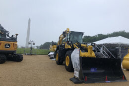 Construction equipment on exhibit on the National Mall, in front of the Smithsonian Castle (WTOP/Dick Uliano)