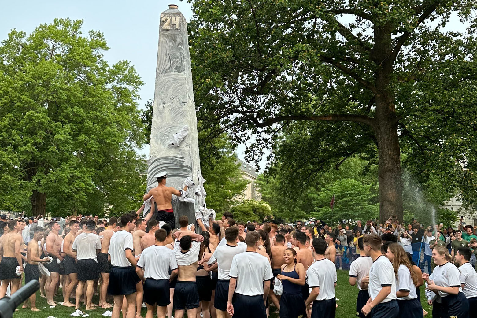 The class of 2026 at the US Naval Academy completing the Herndon Climb (WTOP/Matt Kaufax)