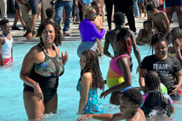 Mayor Bowser jumps into the Randall Pool to celebrate the beginning of pool season in D.C. (WTOP/Matt Kaufax)