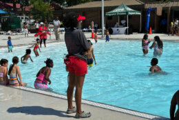 Kids playing in the Randall Pool to celebrate the beginning of pool season in D.C. (WTOP/Matt Kaufax)