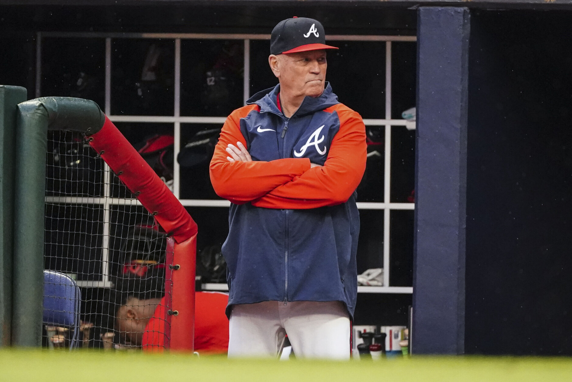 Atlanta Braves manager Brian Snitker (43) watches from the dugout during the first inning of a baseball game against the Baltimore Orioles Friday, May 5, 2023, in Atlanta. (AP Photo/John Bazemore)