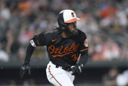 Baltimore Orioles' Cedric Mullins races to third on a triple against the Pittsburgh Pirates in the fifth inning of a baseball game, Friday, May 12, 2023, in Baltimore. (AP Photo/Gail Burton)