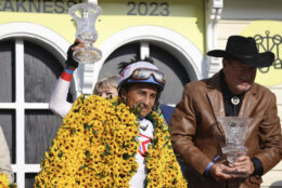 Rafael Bejarano reacts after riding Taxed to win the 98th running of the Black-Eyed Susan horse race at Pimlico Race Course, Friday, May 19, 2023, in Baltimore. (AP Photo/Julia Nikhinson)