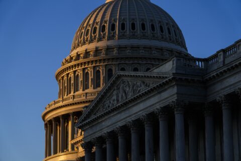 Most favor pairing debt limit rise with deficit cuts, but few following debate closely: AP-NORC poll