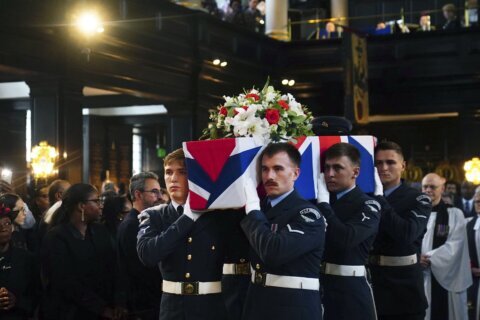 Strangers pay tribute at burial for Jamaican WWII vet who volunteered in Britain's hour of need