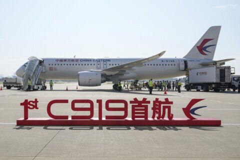 China’s 1st domestically made passenger plane completes maiden commercial flight