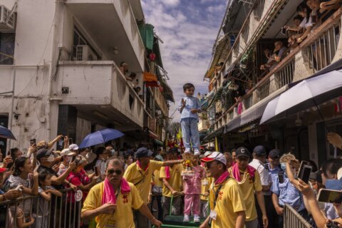 AP PHOTOS: Hong Kong’s colorful Bun Festival returns after COVID-19 cancellations