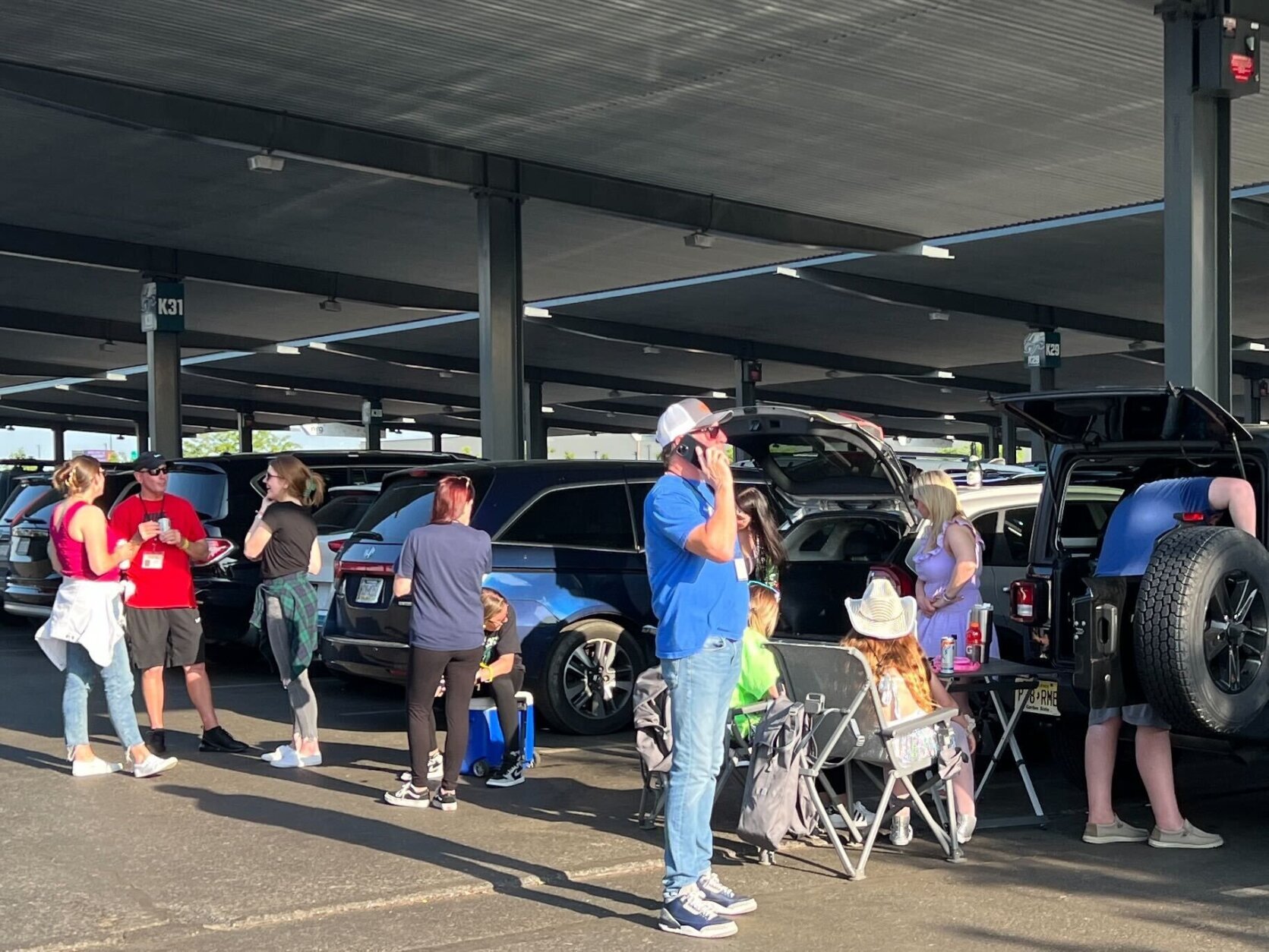 <p>Not everyone in the parking lot had tickets for the show. Some showed up hoping to buy last minute tickets while others sat outside to listen to the concert.</p>
