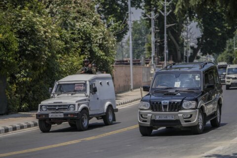 G20 delegates begin meeting in disputed Kashmir, with region's intense security largely out of view