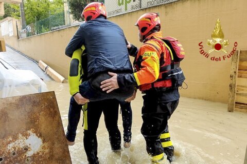 Rain-swollen rivers flood some towns in north Italy; Venice prepares to raise mobile dike in lagoon