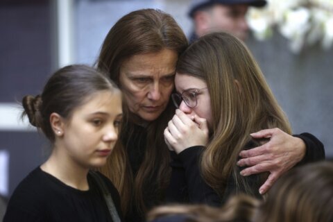 Burials held in Serbia for some victims of mass shootings