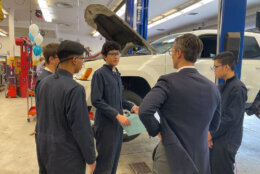 Auto tech students at Lake Braddock Secondary School in Fairfax County got the chance to hone their skills fixing cars abandoned at D.C.-area airports. (WTOP/Kyle Cooper)