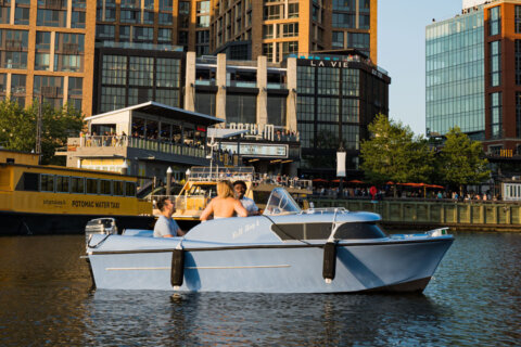 Retro 1950s-era fiberglass powerboats for rent at The Wharf