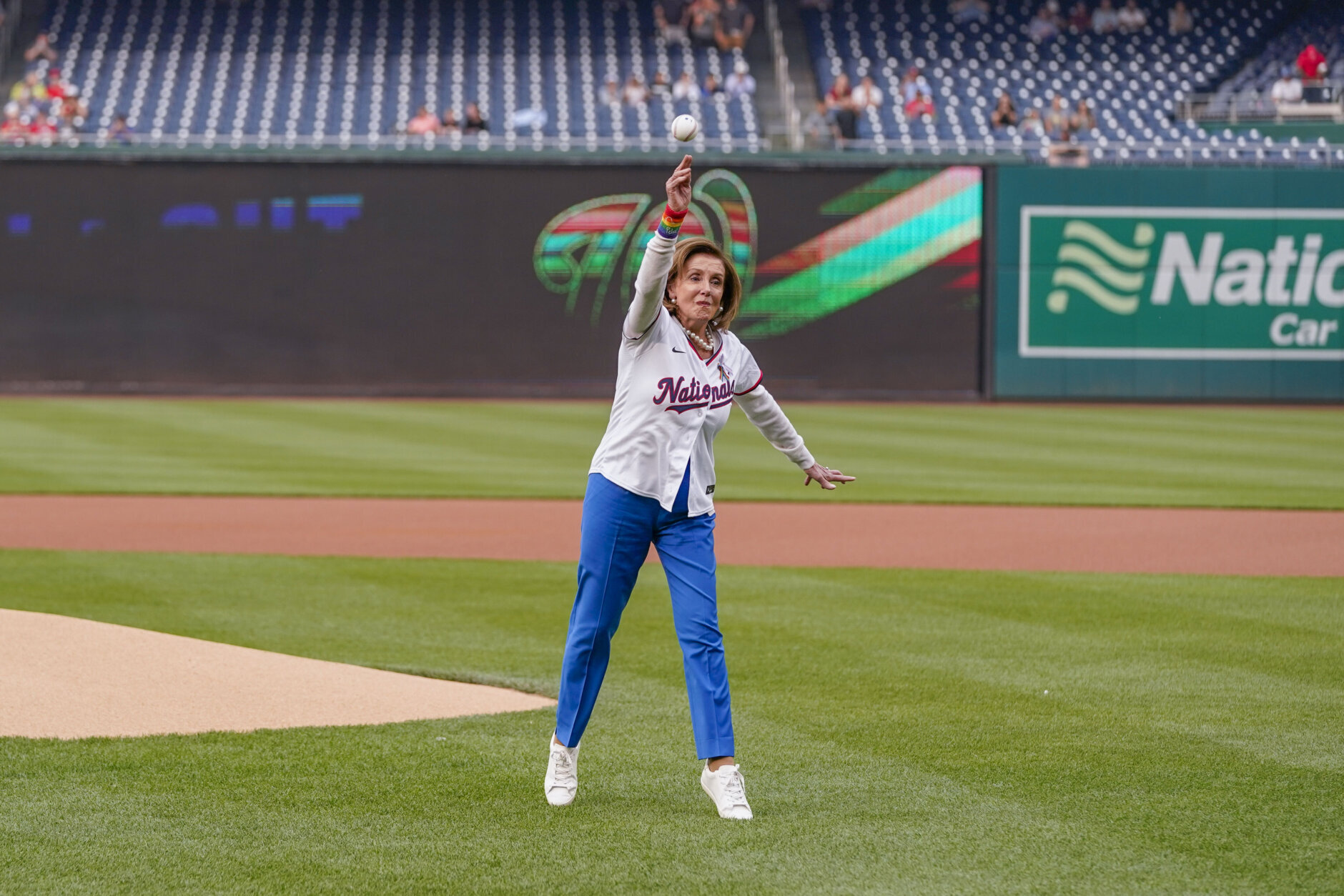 Rep. Nancy Pelosi, D-Calif., throws out a ceremonial first pitch before a baseball game between the Washington Nationals and the Arizona Diamondbacks at Nationals Park, Tuesday, June 6, 2023, in Washington. The Nationals celebrated Pride month with their 18th Night OUT event. (AP Photo/Alex Brandon)
