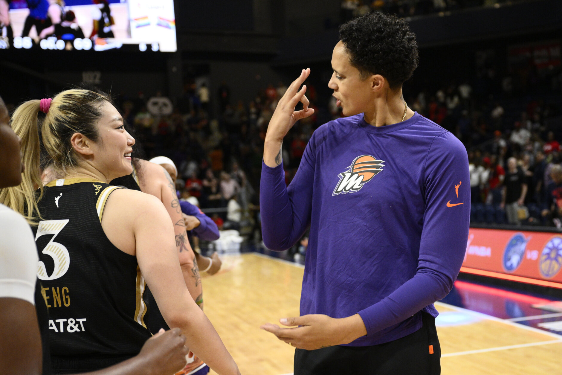 <p>Phoenix Mercury center Brittney Griner, right, talks with Washington Mystics guard Li Meng after a WNBA basketball game Friday, June 16, 2023, in Washington. The Mystics won 88-69. (AP Photo/Nick Wass)</p>
