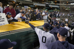 New York Yankees' Domingo Germán (0) gestures to fans while leaving the field after he pitched a perfect game against the Oakland Athletics in a baseball game in Oakland, Calif., Wednesday, June 28, 2023. The Yankees won 11-0. (AP Photo/Godofredo A. Vásquez)